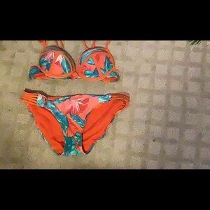 Coral,cream, and green two piece bathing suite.